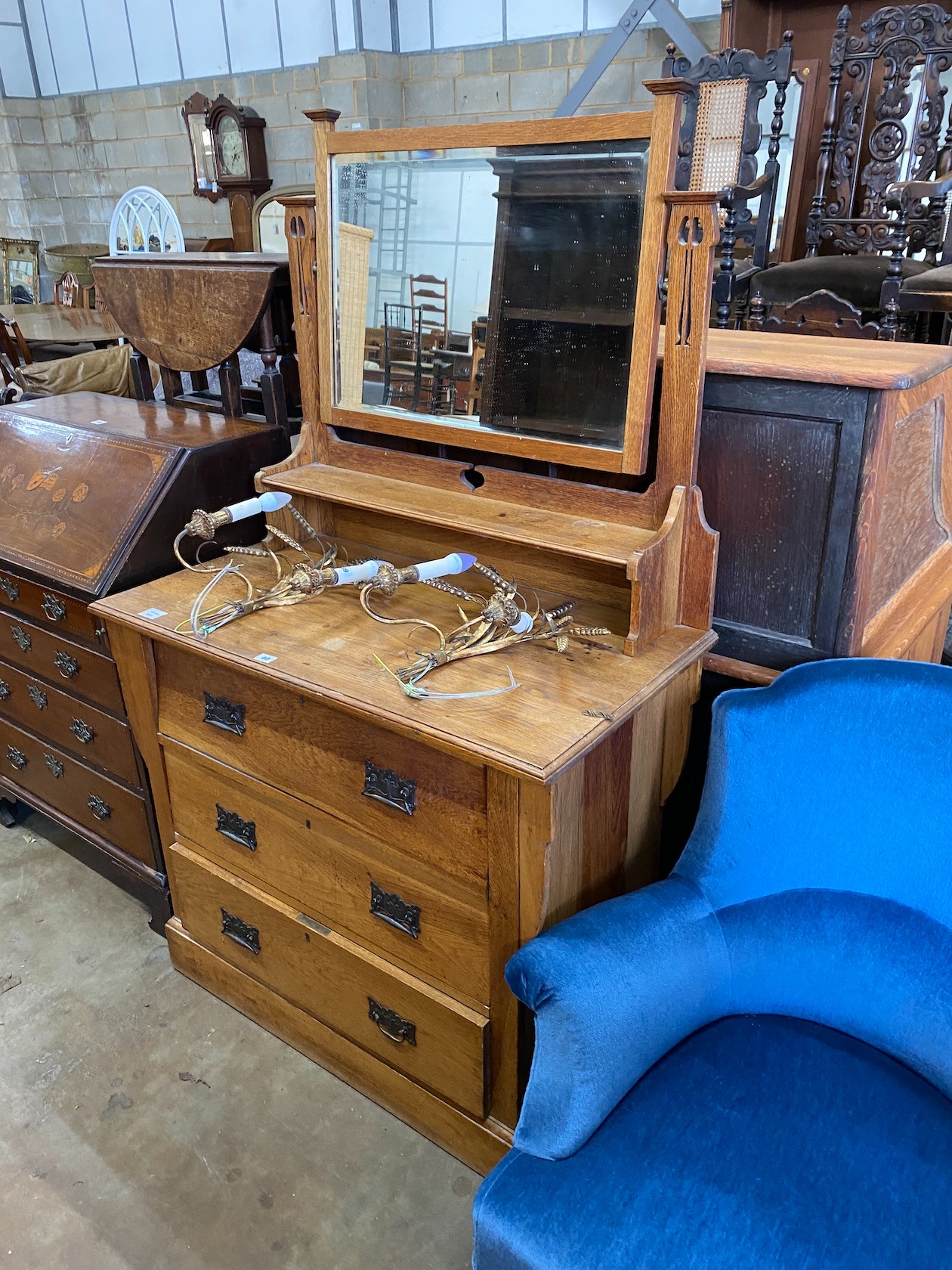 An Arts & Crafts oak dressing chest, width 99cm, depth 53cm, height 164cm *Please note the sale commences at 9am.